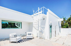 Pool Deck View of Spiral Staircase to Roof at 7647 Sanderling Road