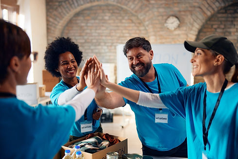 group-of-happy-volunteers-gathering-hands-in-unity-2024-02-09-19-33-52-utc.jpg