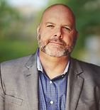 John M. Behles, Esq.