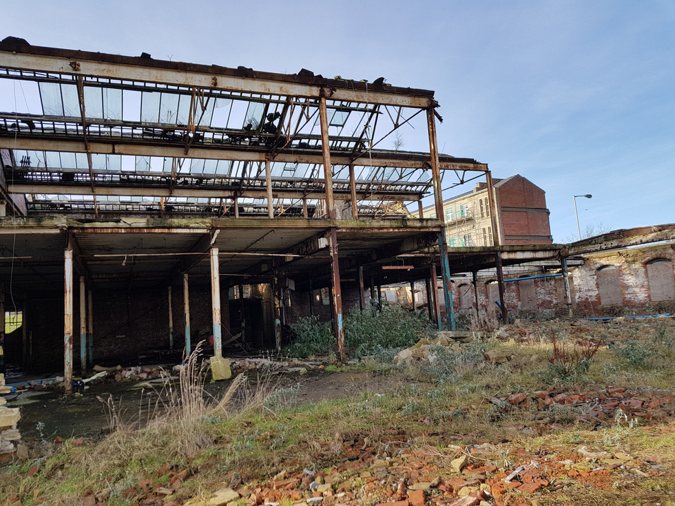 steel beams attached to damaged building