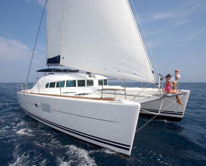 Create Ibiza catamaran charter with snorkeling & paddleboarding near San Antonio