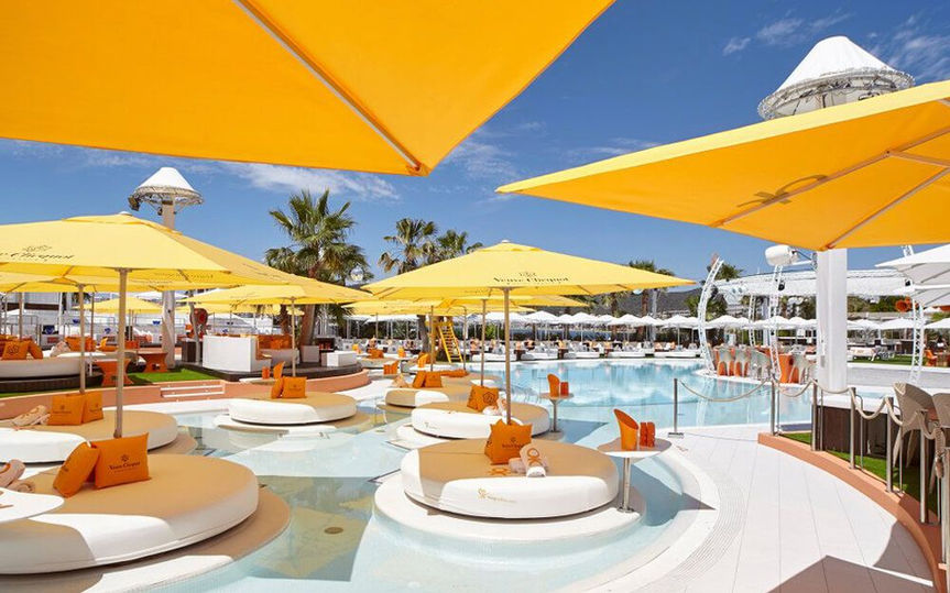 Create Ibiza guests playing drinking games at the biggest Ibiza pool crawl event.