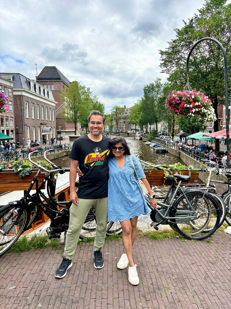 Exploring the charming canals of Amsterdam, surrounded by the city's iconic bicycles.