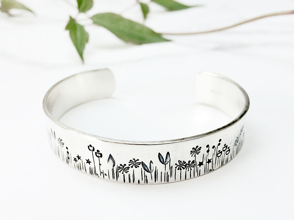 Thumbnail: Silver cuff stamped with leaves from side