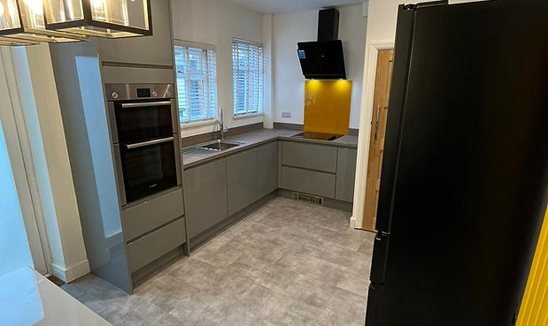new fitted grey gloss kitchen with grey vinyl click flooring
