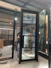 Retro single iron door with clear glass.