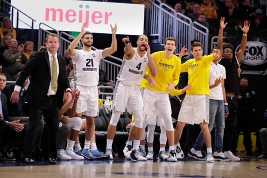 Marquette players cheering on their teammates.