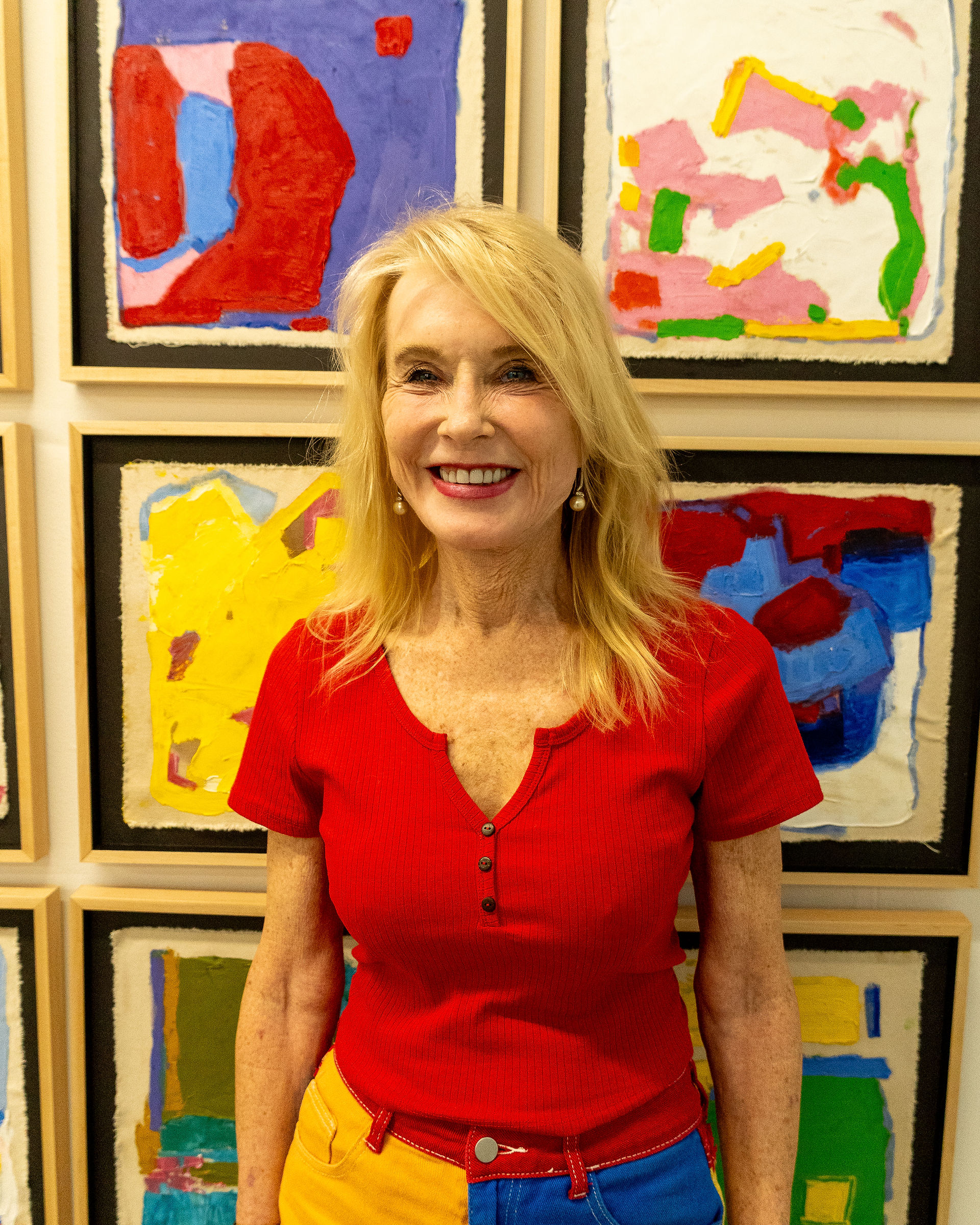 Artist Allison McCrady in front of her artworks showcased at Clio Art Fair's 18th Edition
