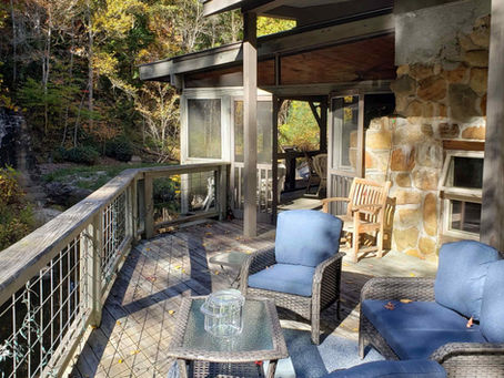 Covered porch with rocking chairs at a luxury cabin in Highlands NC