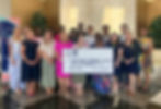 Group holds giant grant check