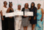 grantees hold up their checks.