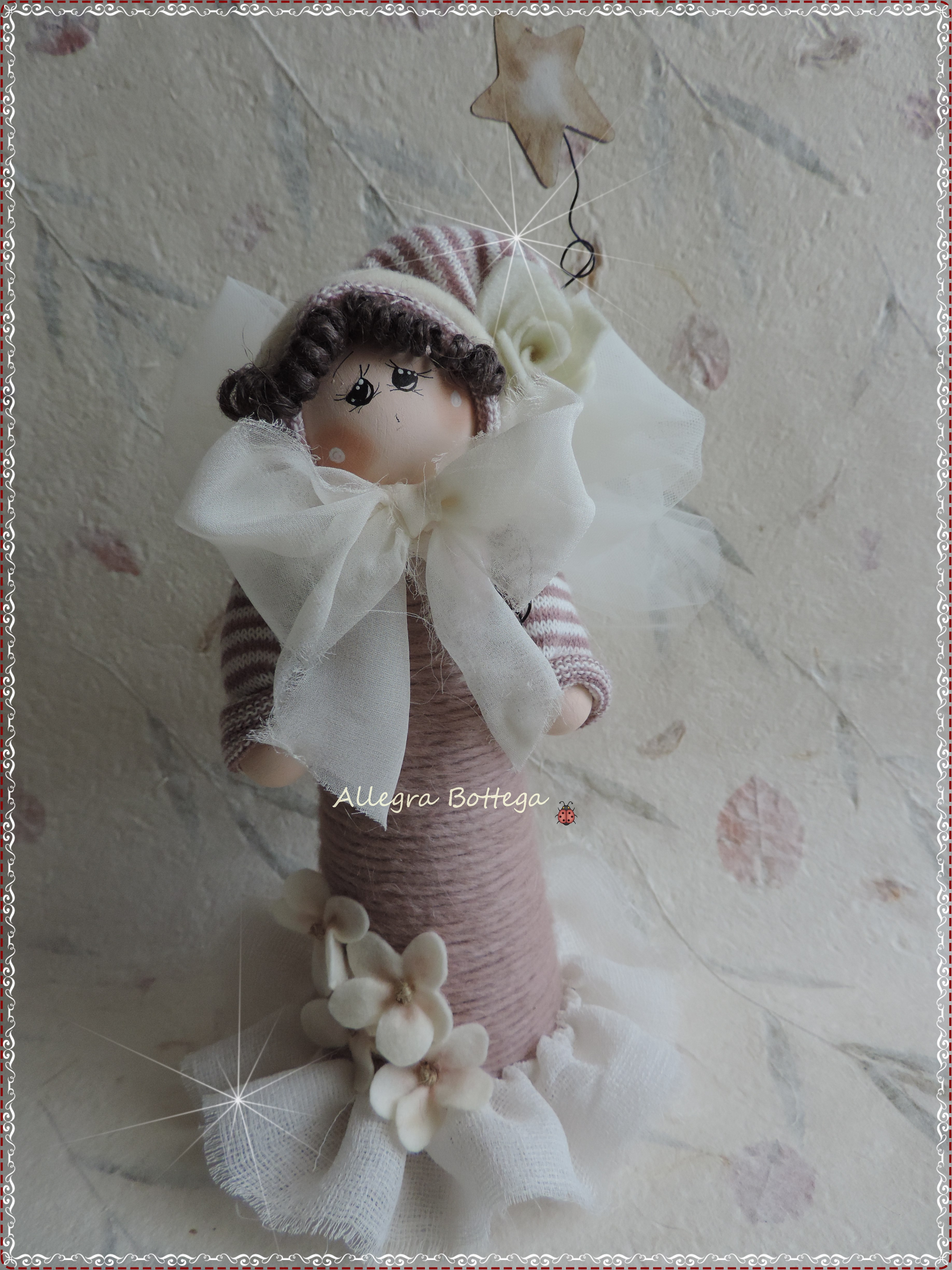 Bambola rosa sul cono