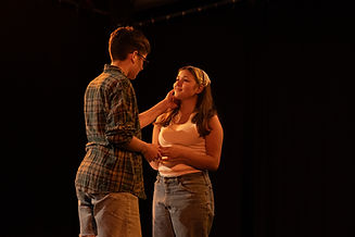 Production photo from Edie and Mae of two actors looking at eachother in a loving embrace