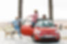 couple-car-greeting-woman-with-dog-outdoors.jpg