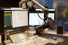 microphone-modern-radio-station-broadcasting-studi-2021-08-26-16-28-51-utc-scaled-2.jpg