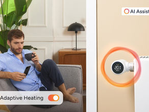 a man sitting on a couch controlling his heating form his phone