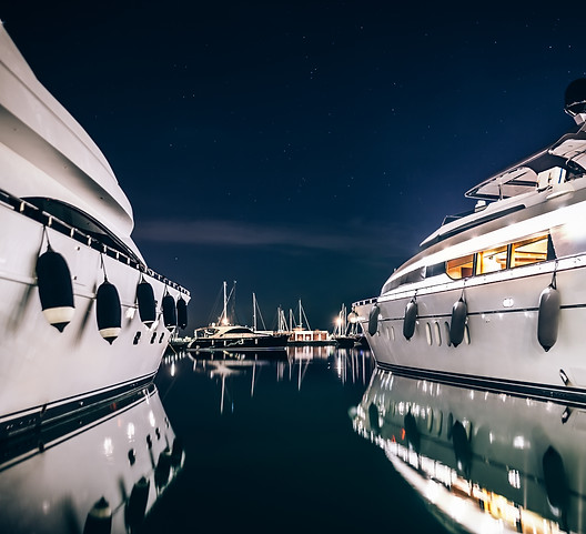 Luxury yachts in La Spezia harbor at nig