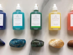 Small plastic bottles aura-soma filled with different coloured liquids with crystals