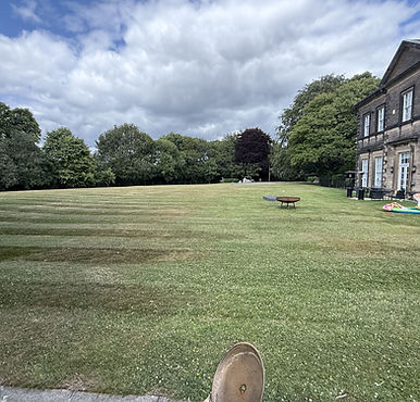 Lawn at The Estate Garden with historic building