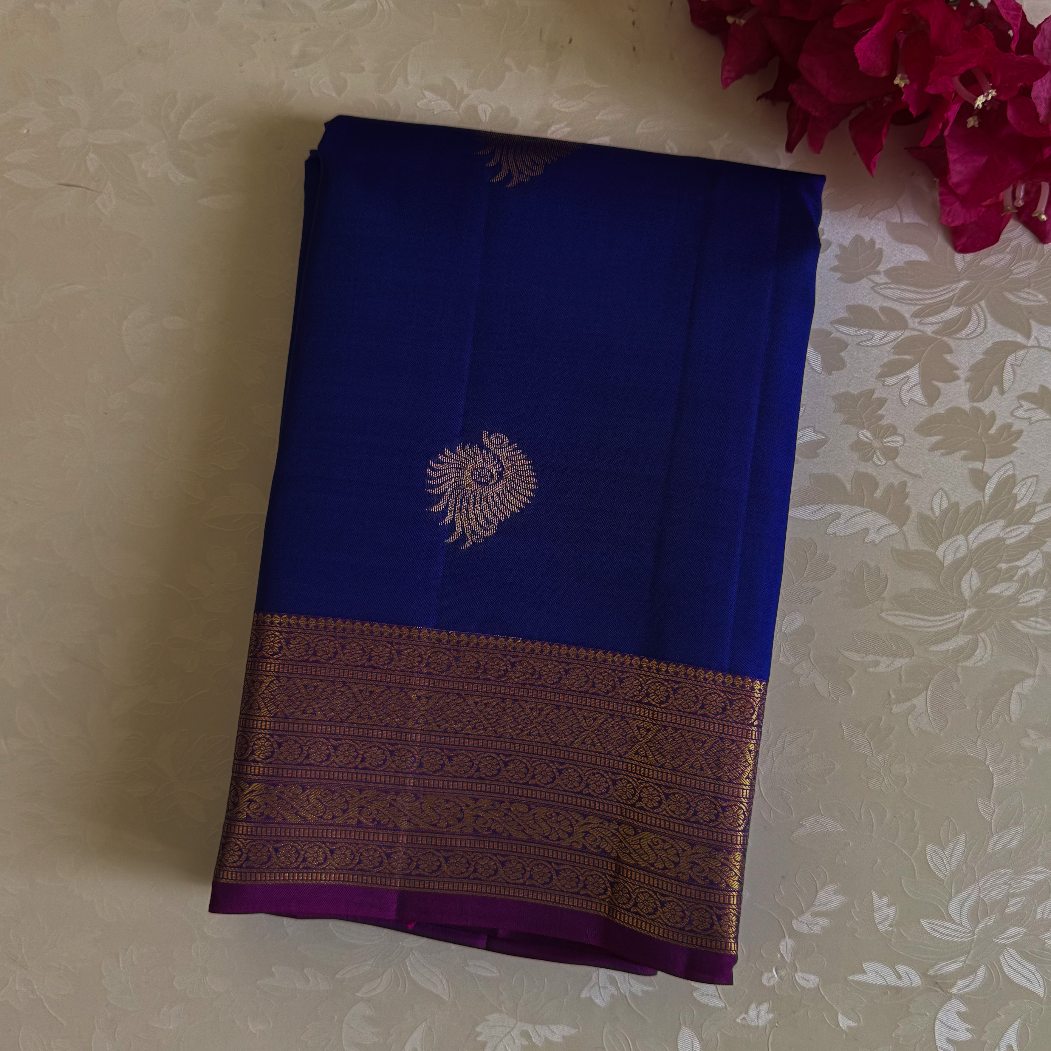 Magnificent blue with deep magenta intricate woven borders n buttas on pure silk