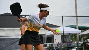 pickleball player hitting a serve