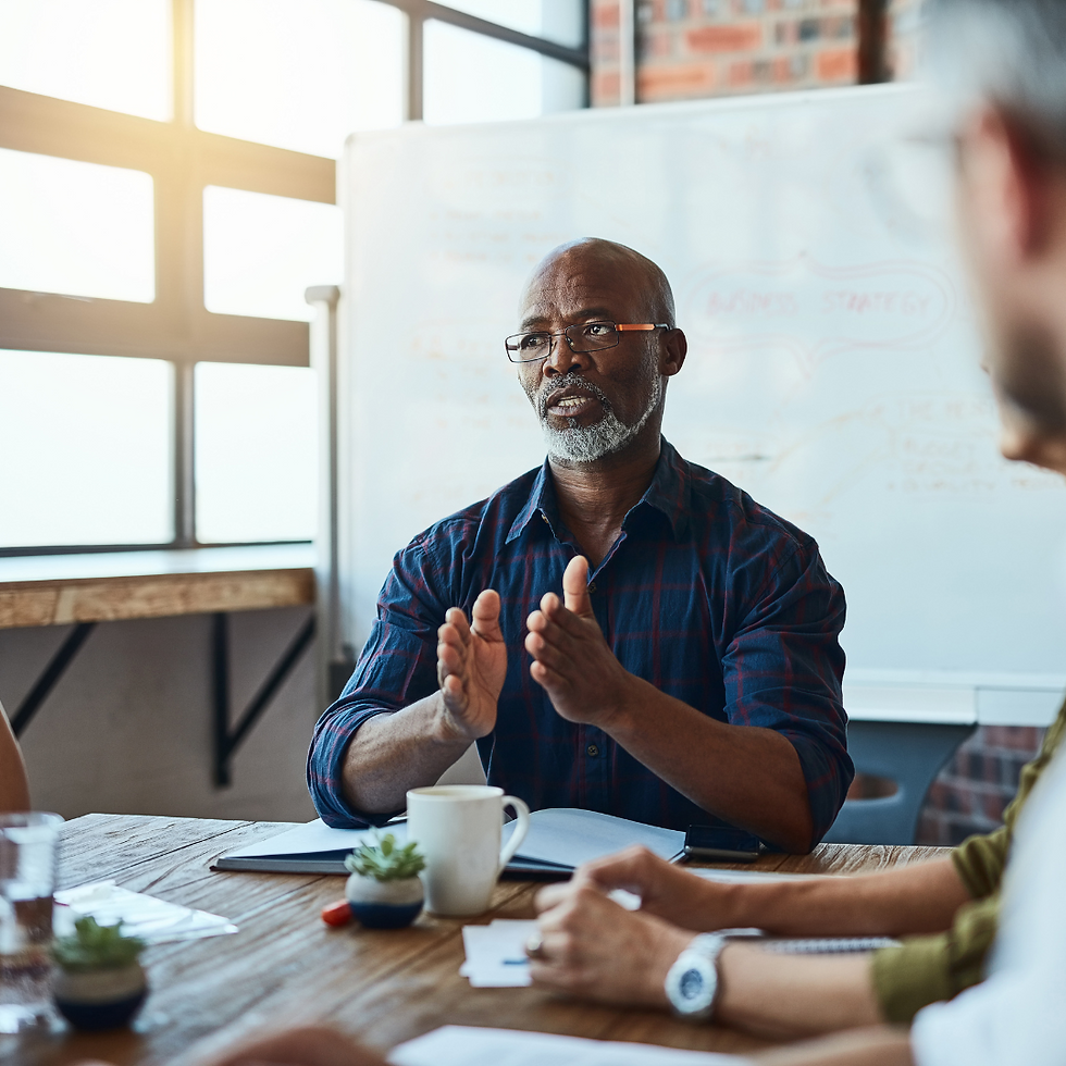 An expert is sitting at a table explaining with authority