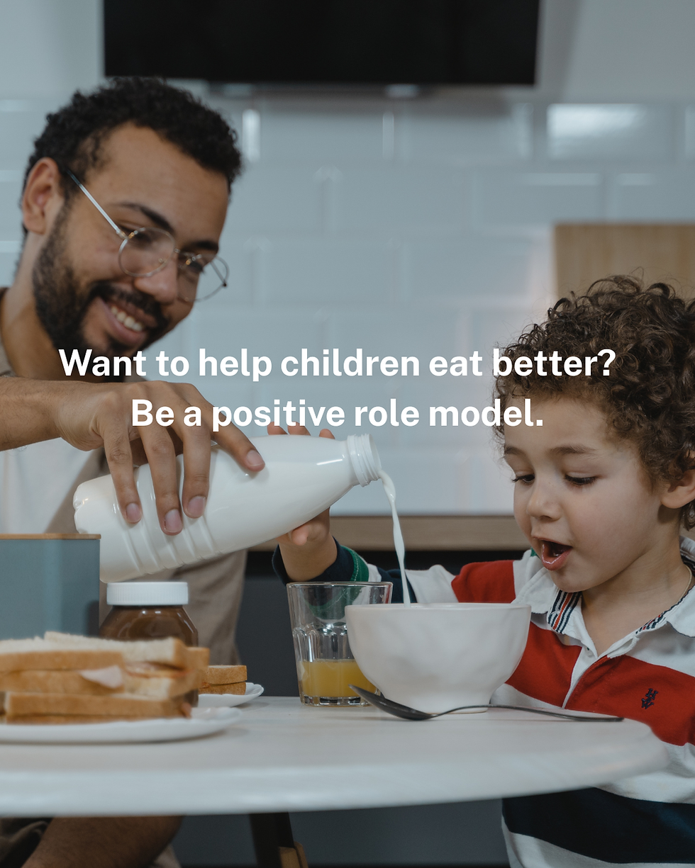 A father pours milk into his child's bowl.