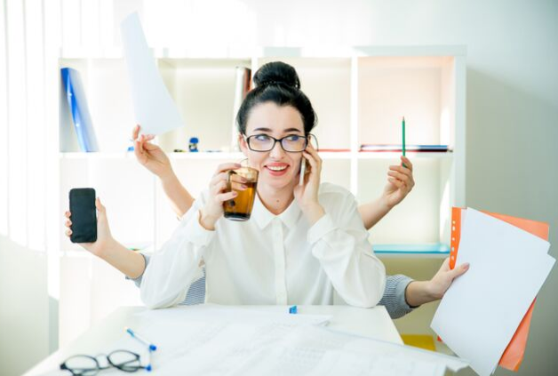 female professional multi-tasking at work