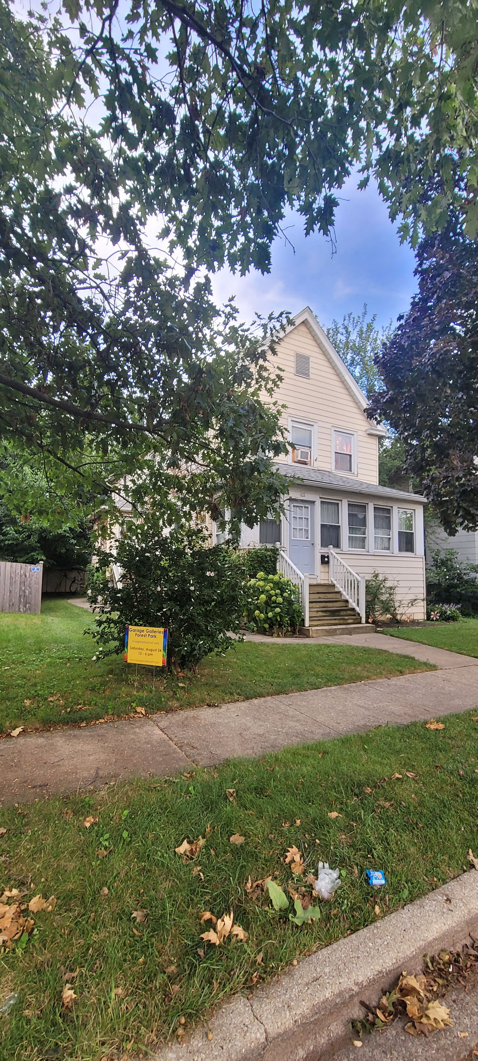 The front of the artist's home with a sign for the "Garage Gallery" event around back