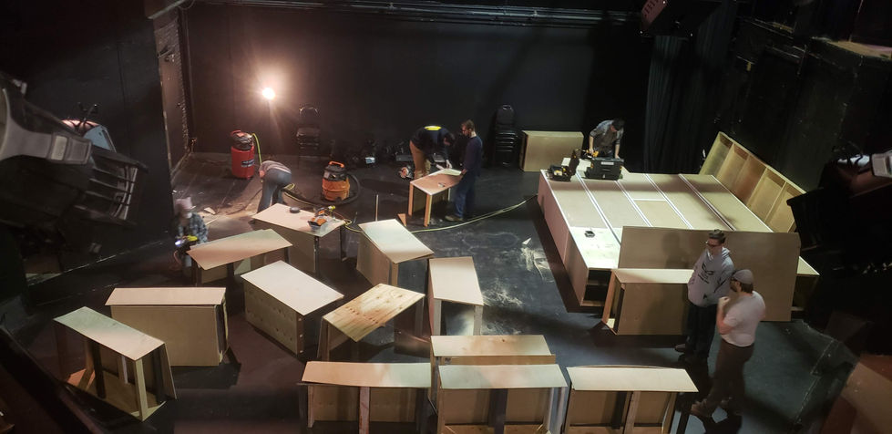 The set of Benefit Committee under construction as seen from above in the Madison Street Theater tech booth