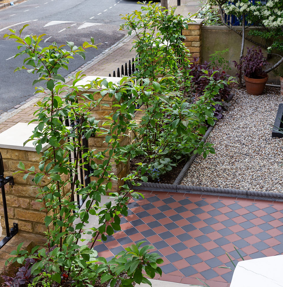 Victorian tiled path with gravel, brick front wall and gravel