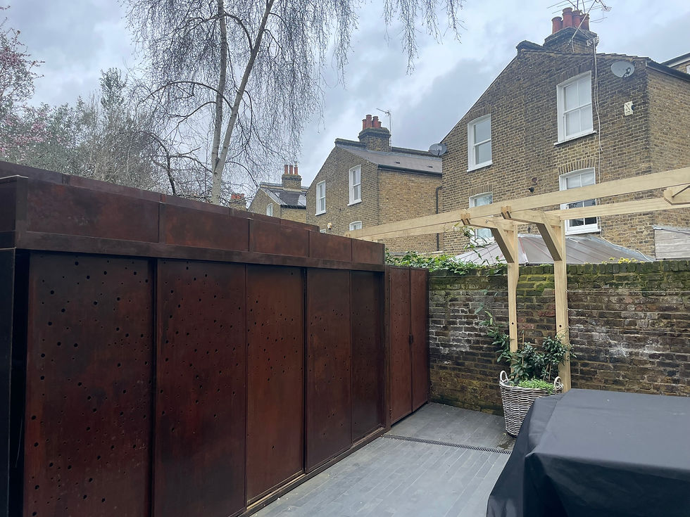 Back garden with Corten steel bike store
