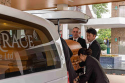 Placing Of Casket Into Hearse