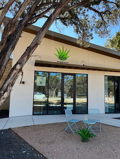 Aloe Wimberley spa storefront in Wimberley TX, a relaxing destination for girls trips and group spa days near the downtown Shopping Square