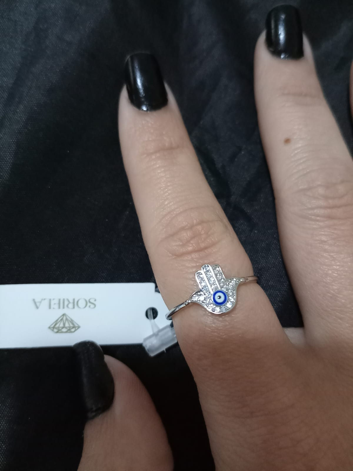 Anel com mão de fátima e olho grego banhado a ródio