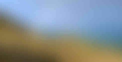 Rainbow forming as rain cloud passes through.