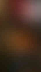 Tattoo artist creating a detailed design on a client’s skin