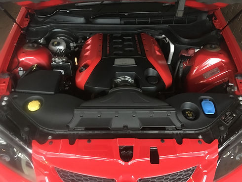 Original and unmodified red 2014 Holden VE Clubsport engine bay