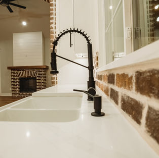 Kitchen faucet with brick wall