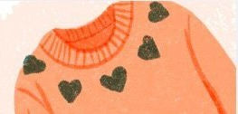 Illustration of a peach jumper with green hearts in it