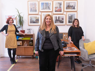 Alice Simpson, Susan Aktemel and Kara Reid smiling in Homes for Good's Glasgow offices