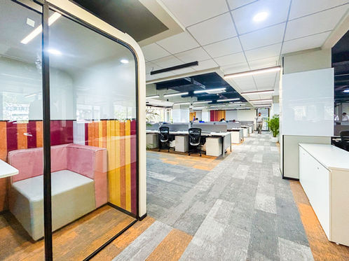 Modern corporate office interior design in Pune focusing on collaborative workspaces and productivity.
