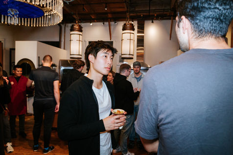 Professionals engaged in conversation at a corporate technology conference in the San Francisco Bay Area, highlighting networ