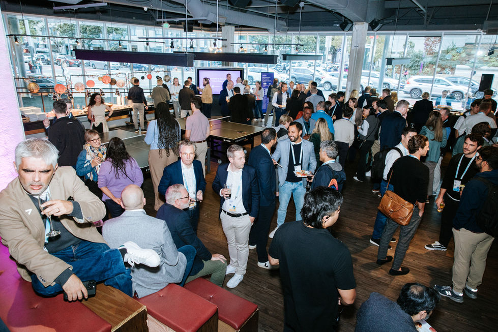 People networking at a lively indoor event.