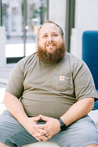 Professional executive headshot of a business professional in downtown San Francisco, photographed with natural light and a m