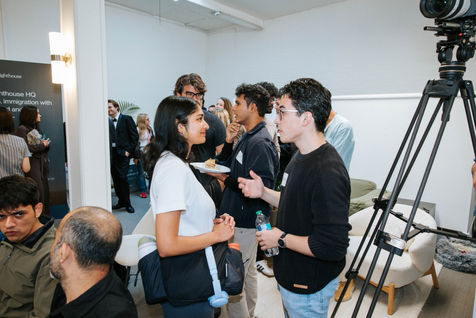 People conversing at a social or networking event.