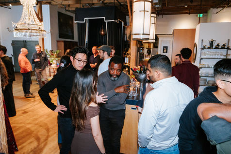Professionals engaged in conversation at a corporate technology conference in the San Francisco Bay Area, highlighting networ