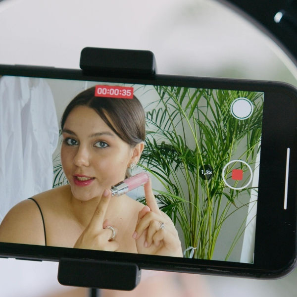 UGC creator recording a video about beauty products