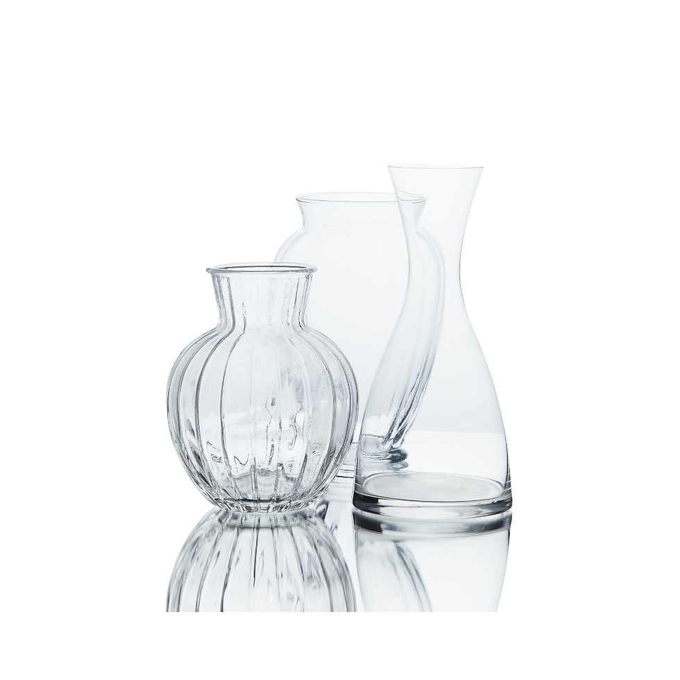 "Modern table vases for centerpieces arranged on a dining table with floral decorations"