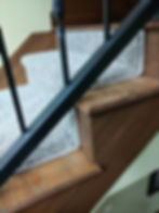 Grey custom stair runners and rugs on wooden steps from a carpet store in Blairsville, Georgia